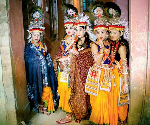 Students of the Nartanalaya Government Dance College of Imphal wait for their entrance during a recital performance of the Maha Ras