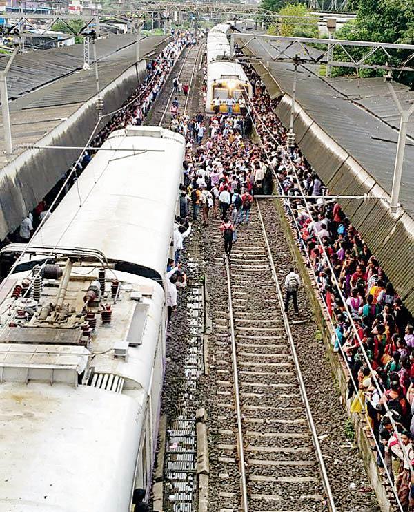 Commuters block a train at the Badlapur railway station to protest recurring delays in services. Pics/Mahendra Jagtap