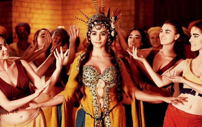 The headgear and costumes are mighty elaborate in Mohenjo Daro