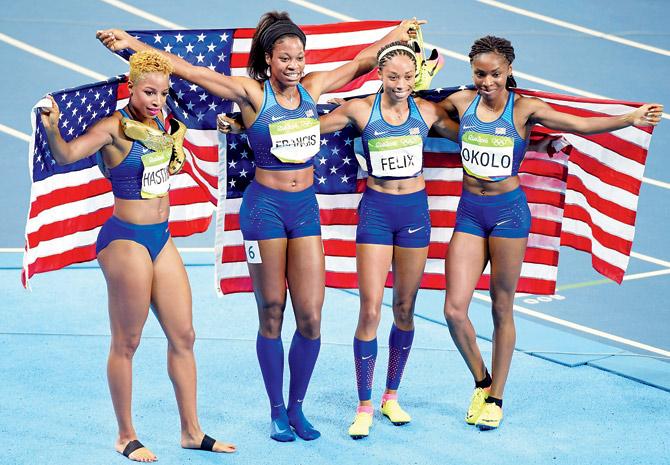 The women’s 4x400m relay winners (from left) Natasha Hastings, Phyllis Francis, Allyson Felix and Courtney Okolo of the United States celebrate in Rio on Saturday Pic/Getty Images