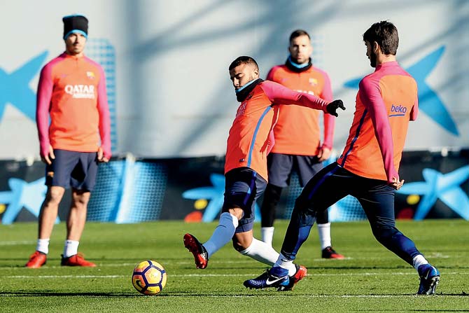Barcelona players during a training session ahead of today’s El Clasico against Real Madrid yesterday. Pic/AFP