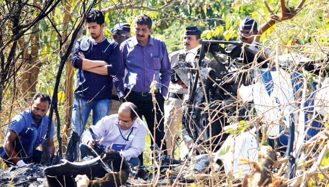 A team of officials flew down from the DGCA in Delhi to investigate the crash site, which was under heavy police protection. Pic/Poonam Bathija