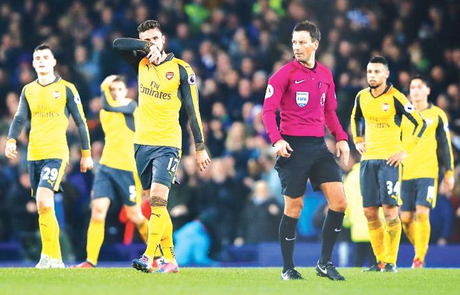 Arsenal players wear a dejected look after their defeat to Everton in an EPL tie at Goodison Park in Liverpool on Tuesday. Pic/Getty Images