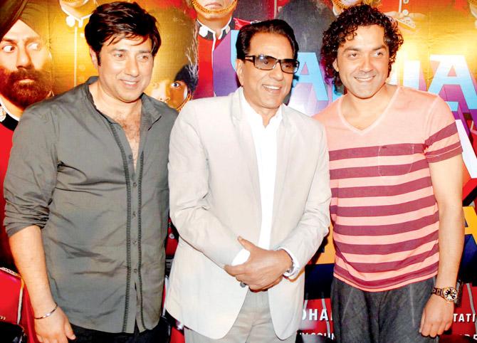 Sunny Deol, Dharmendra and Bobby Deol at a film event in 2013