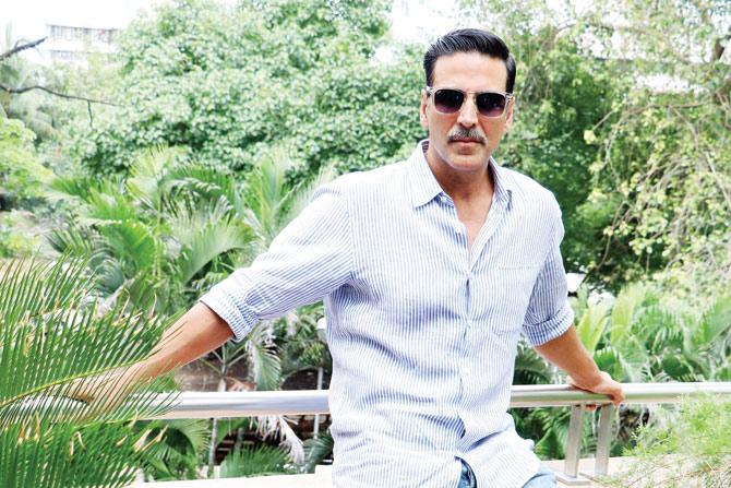 Big screen's favourite action star, Akshay Kumar caught in a relaxed pose  at actress Asin's b'day party, held in Mumbai, on October 25, 2013.