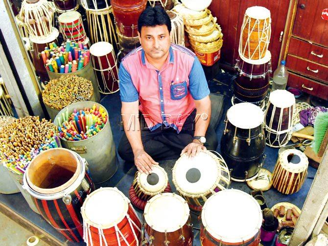 Kamlesh Chauhan at his Malad store where he manufactures and repairs Indian musical instruments. Pic/Nimesh Dave