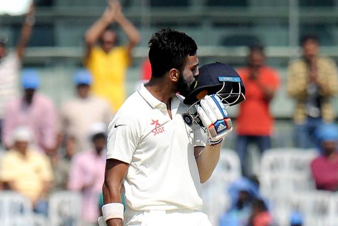 Lokesh Rahul kisses his helmet as he celebrates after scoring a century during the Fifth Test against England at Chepauk Stadium, Chennai. Pic/ AFP