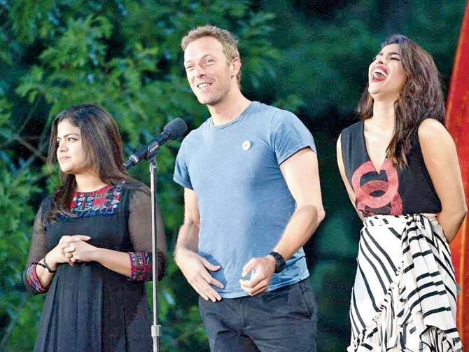 Poonamâu00c2u0080u00c2u0088Mahajan, Chris Martin and Priyanka Chopra on the stage at New York
