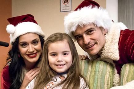 Orlando Bloom and Katy Perry visit children's hospital as Santa Claus