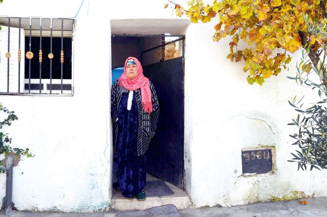 Nourhane Amri, mother of Anis Amri, the prime suspect in Berlin truck attack, in front her house in Oueslatia, Tunisia. Pic/AFP