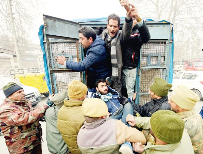 Police detain AIP supporters led by Independent MLA Abdul Rashid Sheikh, during a protest march in Srinagar. Pic/PTI