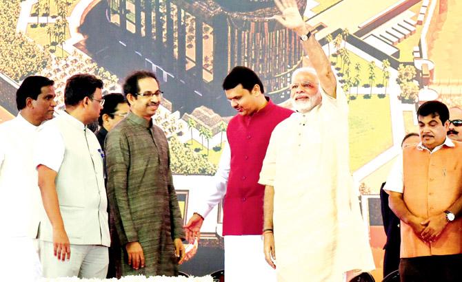 (From left) Shiv Sena chief Uddhav Thackeray, CM Devendra Fadnavis, Prime Minister Narendra Modi and BJP chief Nitin Gadkari at the event where Prime Minister Modi lay the foundation stone for the Shivaji Memorial on Saturday. Pics/Nimish Dave
