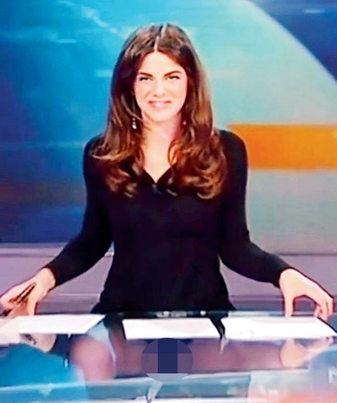 Costanza Calabrese forgets her desk is see-through while presenting the news
