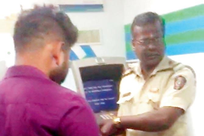 Constable Mahesh Gosavi filmed defying a long ATM queue