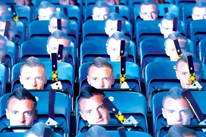 Jamie Vardy masks are left on the seats of the King Power Stadium yesterday. Pic/AFP