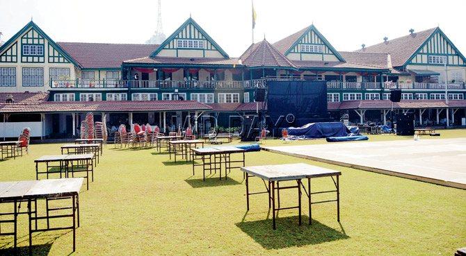 Tables being set up on the lawn outside the Bombay Gymkhana clubhouse for tonight