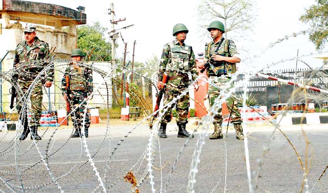 Army personnel stand guard at the 16 Corps headquarters in Jammu during the search operations following the attack on the Nagrota Army camp. Pic/PTI