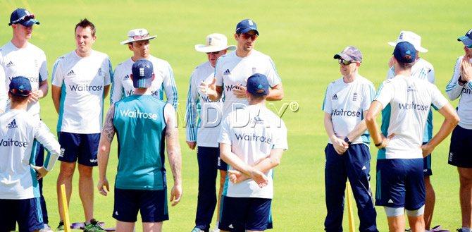 England skipper Alastair Cook (centre) speaks to his team during a practice session on the eve of the fourth Test match against India at the Wankhede Stadium in Mumbai yesterday. Pic/Suresh Karkera