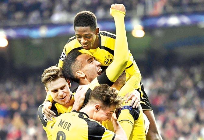 Borussia Dortmund players celebrate their equaliser vs Real Madrid on Wednesday. Pic/AFP