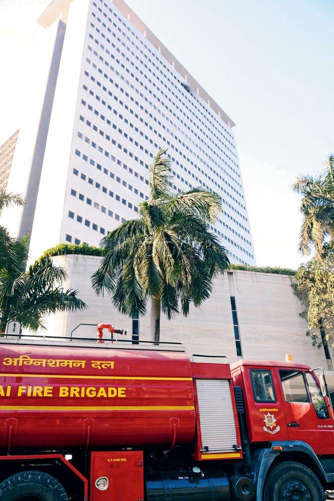 Fire broke out on the 22nd floor of the Air India building this morning; (inset) the blaze in the conference room. pics/sayyed sameer abedi