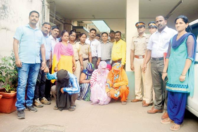 Police with those arrested in the baby-selling racket. Pic/Rajesh Gupta