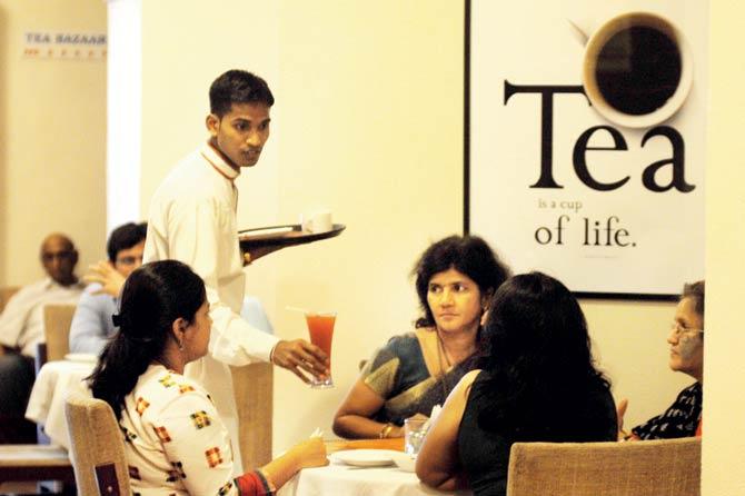 A file photo from 2010 of a steward serving the guests iced tea at the Churchgate cafe