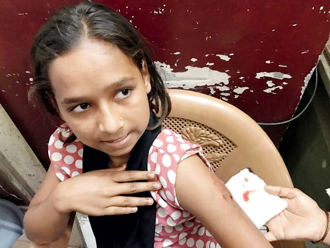 Muskaan Shaikh and another victim are administered first-aid at the hospital
