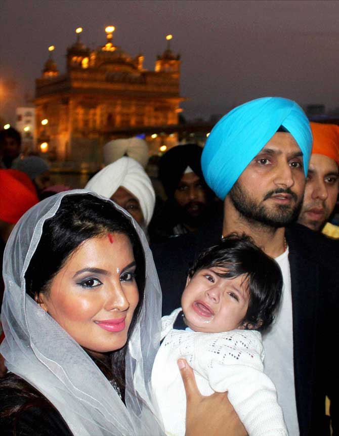 Cricketer Harbhajan Singh and his wife Geeta Basra with their four-month old baby girl at Golden Temple in Amritsar on Thursday. Pic/PTI 