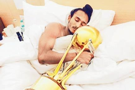 Indian hockey captain Harjeet Singh takes his Jr World Cup trophy to bed