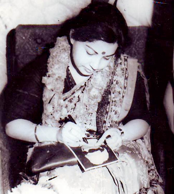 The AIADMK had always followed a tradition of having their leaders’ photos engraved on things like pens, rings, lockets etc, to be stored as memorabilia. Some party men would design their own mementos. This was taken not long after Jayalalithaa was sworn in as Rajya Sabha MP in 1984, in Chennai. Somebody handed her a picture of MGR. Here, she’s seen signing the photo of her mentor