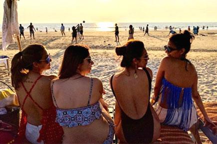 Backless beauties! Malaika, Amrita Arora turn up the heat on the beach