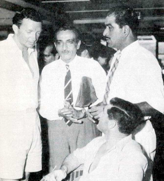 In Picture: Australian stalwarts Neil Harvey (seated) and Richie Benaud (left) chat with  Vijay Merchant (centre) and India skipper GS Ramchand in 1960