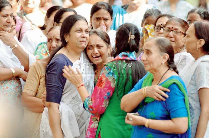 Ritesh Modi’s mother and relatives mourn at his funeral on Wednesday