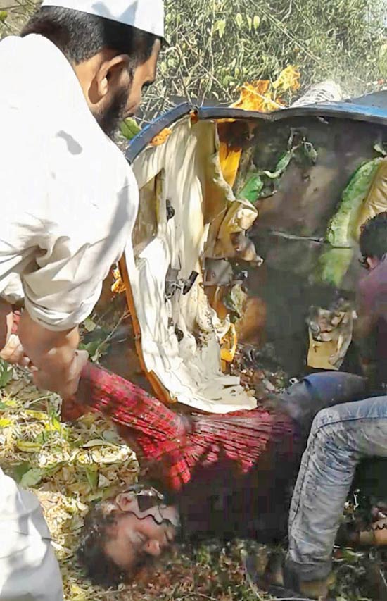Locals drag Ritesh Modi out of the burning chopper