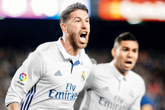 Real Madrid’s Sergio Ramos celebrates scoring a goal against Barca during the La Liga tie at Camp Nou on Saturday.