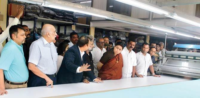 Union textile minister Smriti Irani interacts with the officials at a Bhiwandi powerloom on Saturday