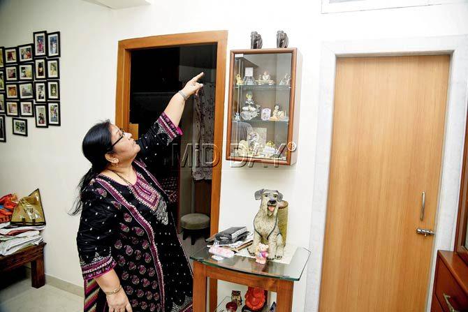 Sohini Bhutani points to the leakage in her house. The BMC claims they had also demolished the extended part of a bathroom in the upstairs flat that was causing the leakage