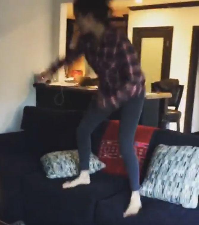 Watch Sunny Leone jump on a couch and dance wildly!