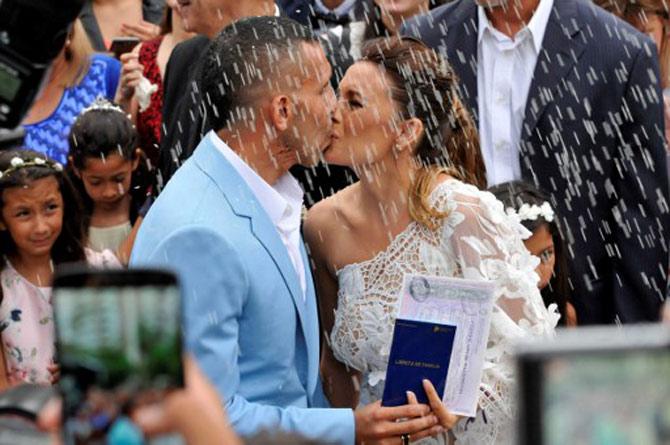 Carlos Tevez kisses his wife
