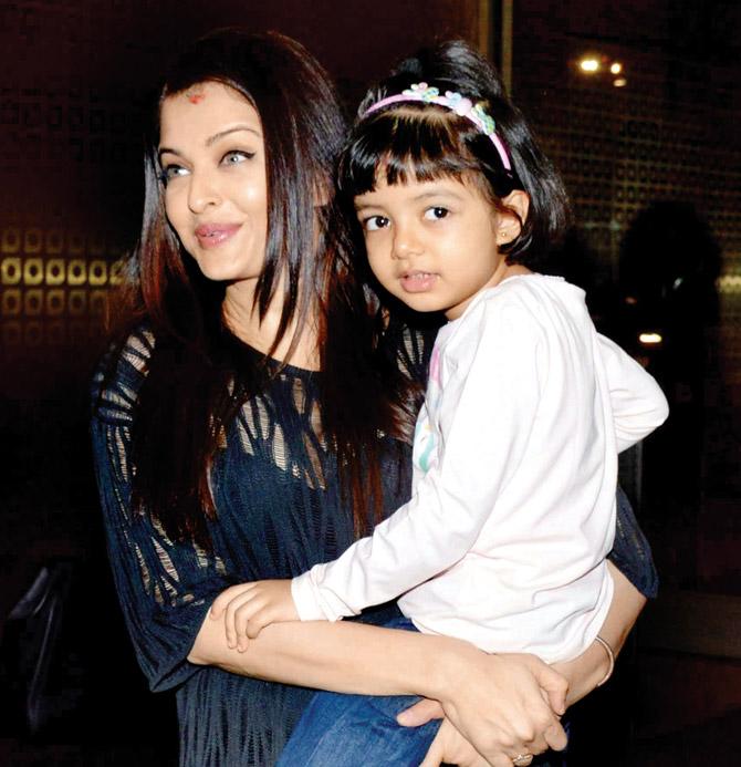 Aishwarya Rai Bachchan with daughter Aaradhya; (right) Abhishek Bachchan
