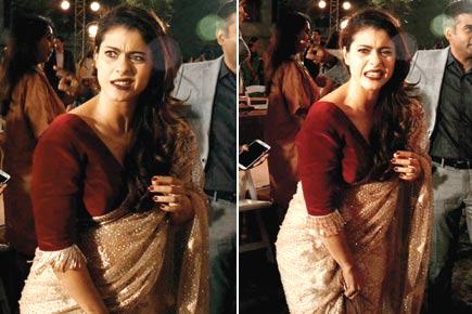 Oops! Kajol struggles with sari during a fashion week's curtain raiser