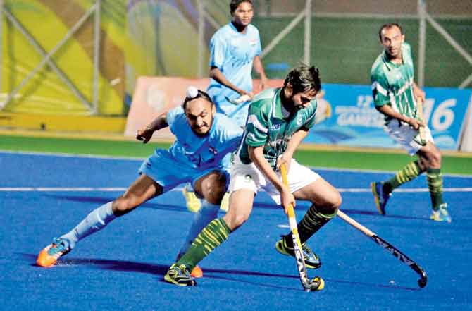 Action from the Indo-Pak group tie which the hosts lost 1-2