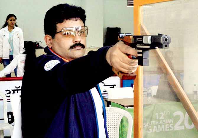 Veteran marksman Samaresh Jung en route his gold medal-winning performance in the individual 25m center fire pistol event yesterday. Pics/PTI