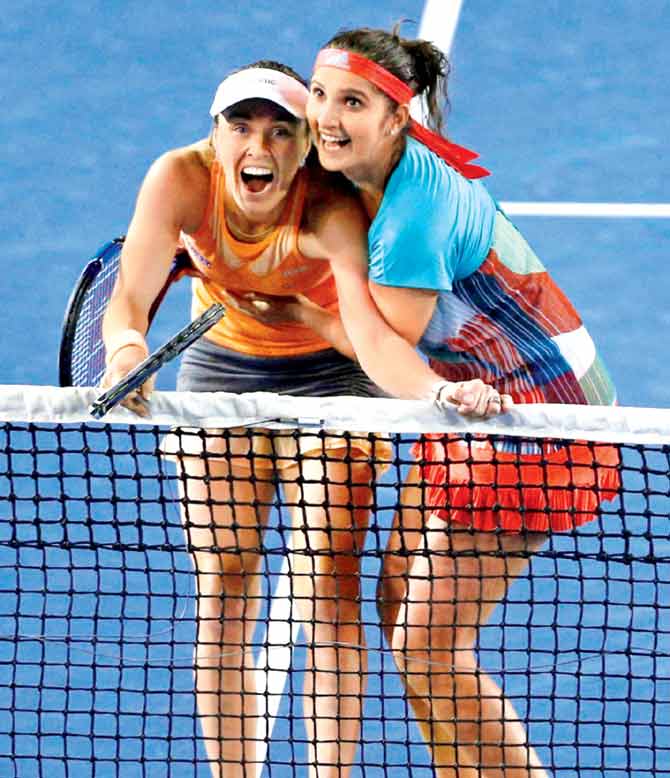Sania Mirza (right) & Martina Hingis at the Australian Open. Pic: AP/PTI