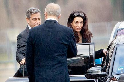 Clooneys play 'Peacemaker', meet Chancellor Angela Merkel