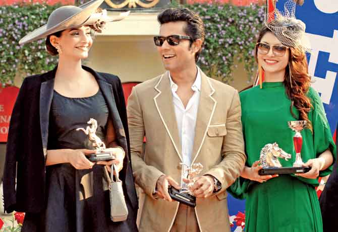 A pretty picture: Bollywood actors Sonam Kapoor (left), Randeep Hooda and Urvashi Rautela (right) are all smiles during the prize distribution of the mid-day Trophy race at Mahalaxmi Racecourse last year
