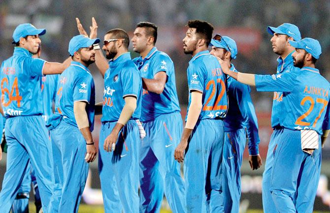 India’s R Ashwin (centre) celebrates with teammates after the dismissal of Sri Lanka captain Dinesh Chandimal during the third T20 international in Visakhapatnam yesterday. Pic/AFP