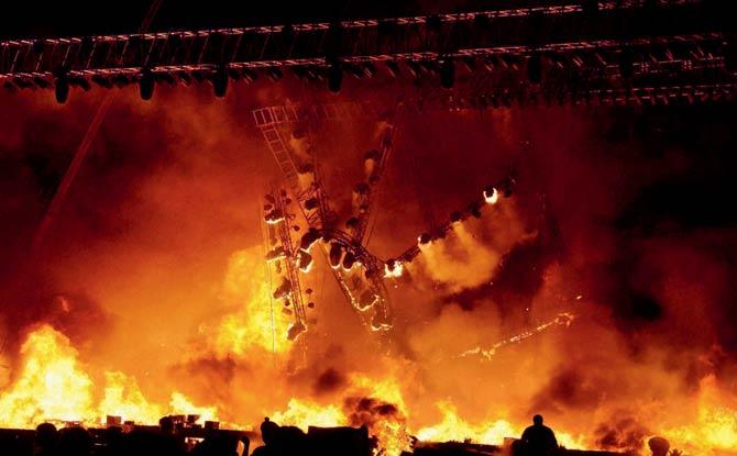 The fire broke out underneath the stage during Make in India week’s Maharashtra night, engulfing it and causing chaos. Pic/PTI