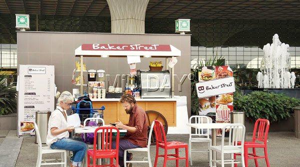 Travellers enjoy a snack at the temporary Baker Street outpost outside Departure area. Pics/Nimesh Dave