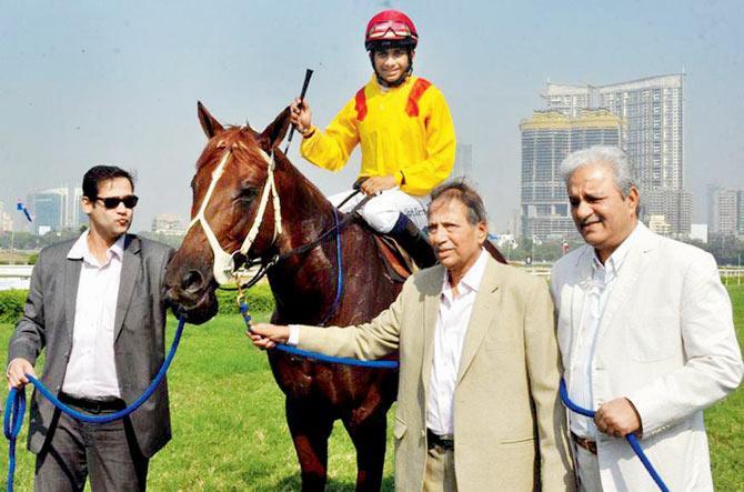 (Above) Quasar notches up another win; (From left) Co-owners Tanmay Agashe, Madhav Patankar and Jaydev Mody with their prized horse
